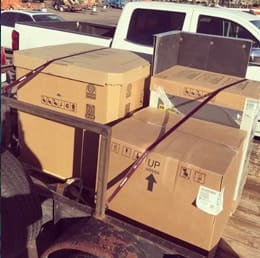 New AC equipment strapped to the truck for delivery and installation